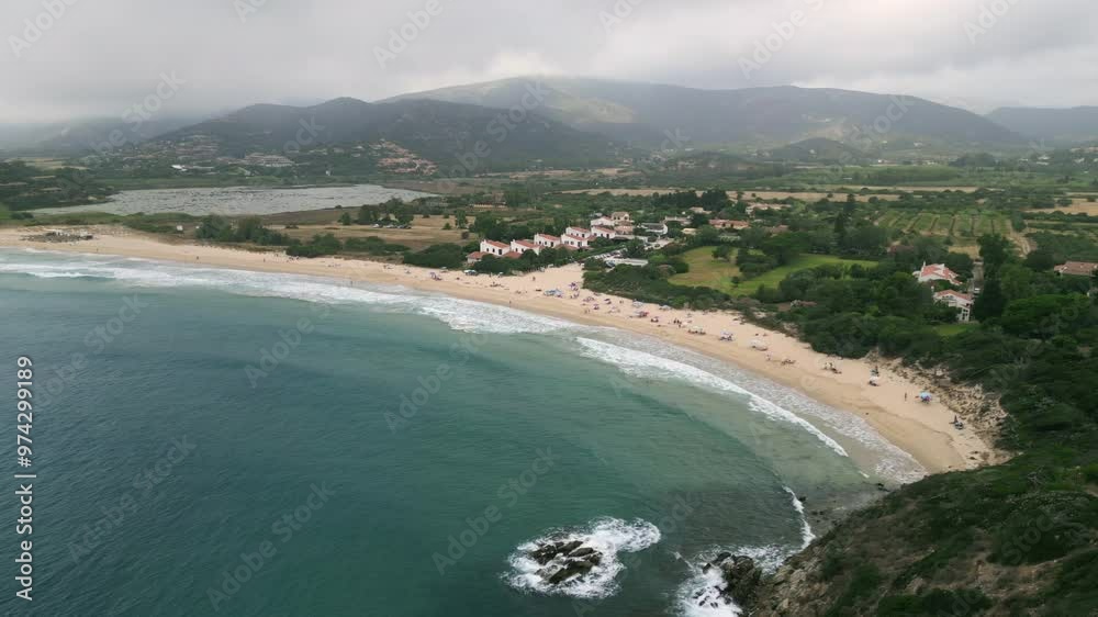 Aerial dolly in Chia, Sardinia, Italy with view of Sa Colonia Beach. Cloudy day, seagull in the beginning. 4K Drone Video. Aerial Shot. Aerial dolly in Chia, Sardinia, Italy with view of Sa Colonia Beach. Cloudy day, seagull in the beginning. 4K Drone Video. Aerial Shot.