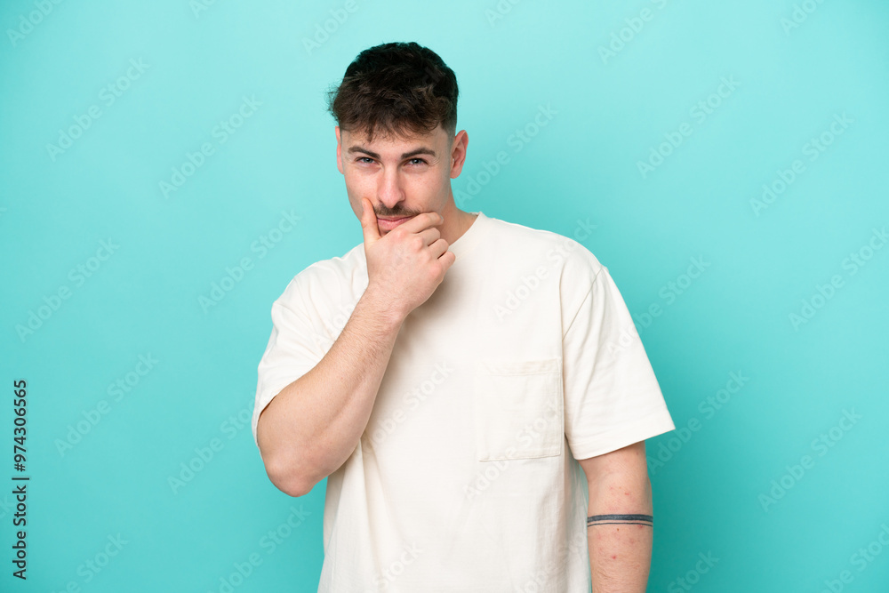 Young caucasian handsome man isolated on blue background thinking Young caucasian handsome man isolated on blue background thinking