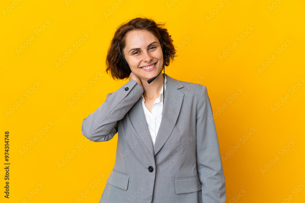 Young English woman isolated on yellow background laughing Young English woman isolated on yellow background laughing