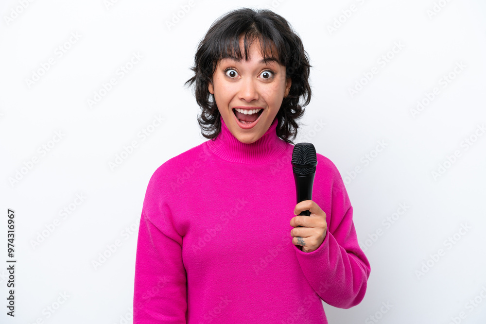 Young Argentinian singer woman isolated on white background with surprise facial expression
