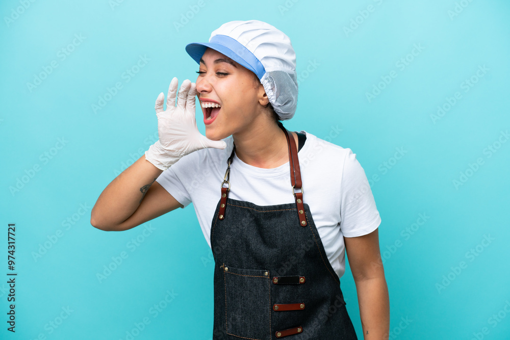Fishwife Argentinian woman isolated on blue background shouting with mouth wide open to the side Fishwife Argentinian woman isolated on blue background shouting with mouth wide open to the side
