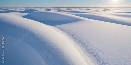 From above of smooth surface of white snow on sunny winter day as background 