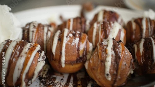 Sweet fried dough balls with chocolate syrup.