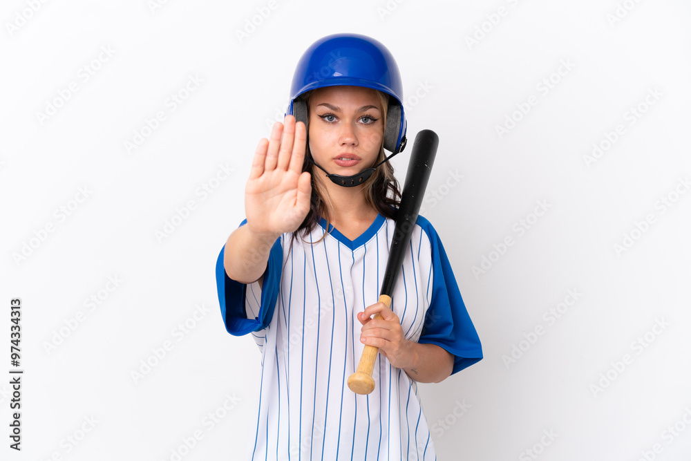 Baseball Russian girl player with helmet and bat isolated on white background making stop gesture Baseball Russian girl player with helmet and bat isolated on white background making stop gesture