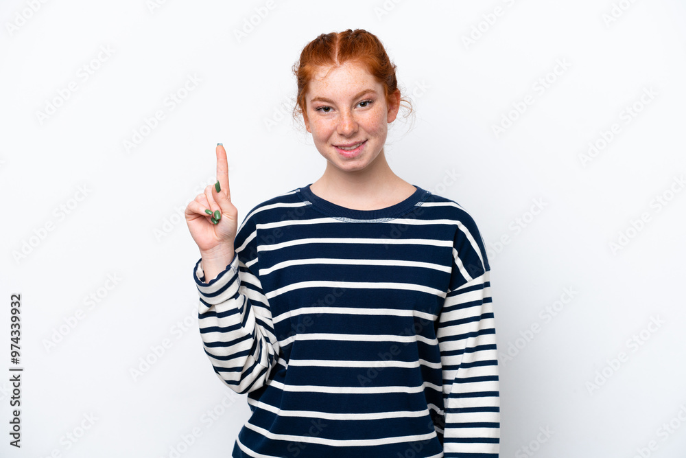 Young reddish woman isolated on white background showing and lifting a finger in sign of the best Young reddish woman isolated on white background showing and lifting a finger in sign of the best