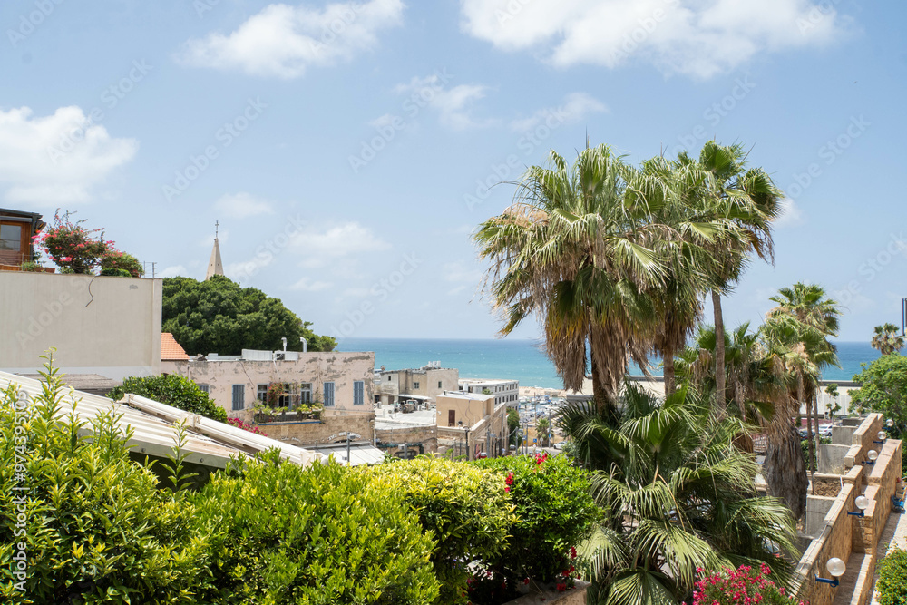 View at old houses of Jaffa neighborhood, Mediterranean sea and Jaffa port during summer. 