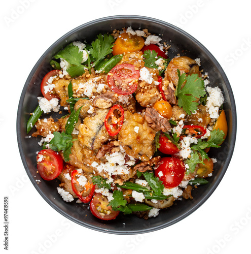 A vibrant salad featuring tempura-battered eggplant, juicy tomatoes, crunchy nuts, crumbled bryndza cheese, and fresh cilantro.