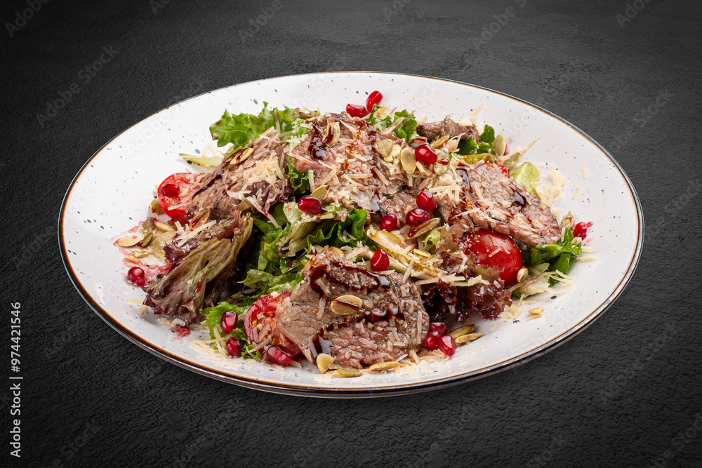 A fresh salad featuring tender veal, juicy cherry tomatoes, and crunchy pomegranate seeds. A fresh salad featuring tender veal, juicy cherry tomatoes, and crunchy pomegranate seeds.