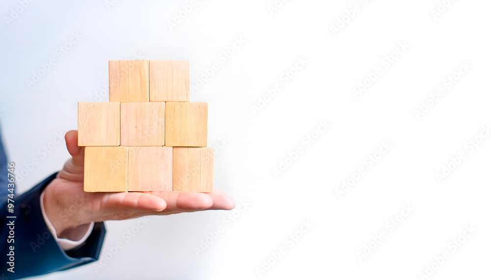 Hands holding wooden block puzzle with symbol