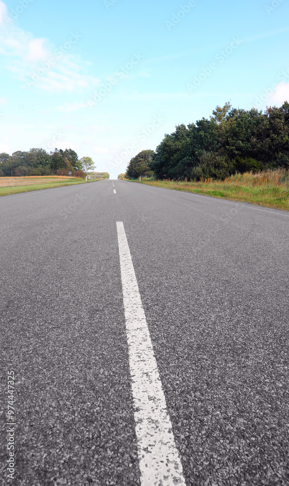 Center line on the endless straight asphalt road Center line on the endless straight asphalt road