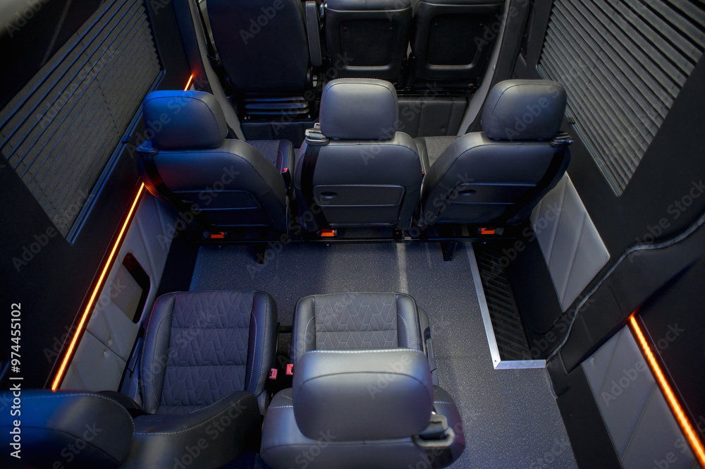 Fototapeta premium Comfortable interior of a passenger bus with soft seats. The design is made to order. Private covering of cars. Various elements of the bus interior.