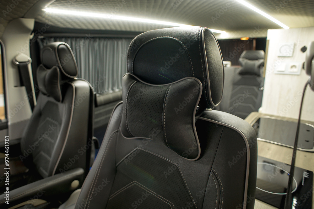 Comfortable interior of a passenger bus with soft seats. The design is made to order. Private covering of cars. Various elements of the bus interior. Comfortable interior of a passenger bus with soft seats. The design is made to order. Private covering of cars. Various elements of the bus interior.