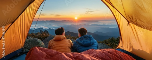 Two friends enjoy a breathtaking sunset view from their tent, surrounded by nature's beauty and peaceful serenity.