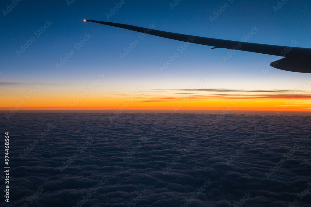 China Shanghai - Sunrise above the clouds from the plane China Shanghai - Sunrise above the clouds from the plane