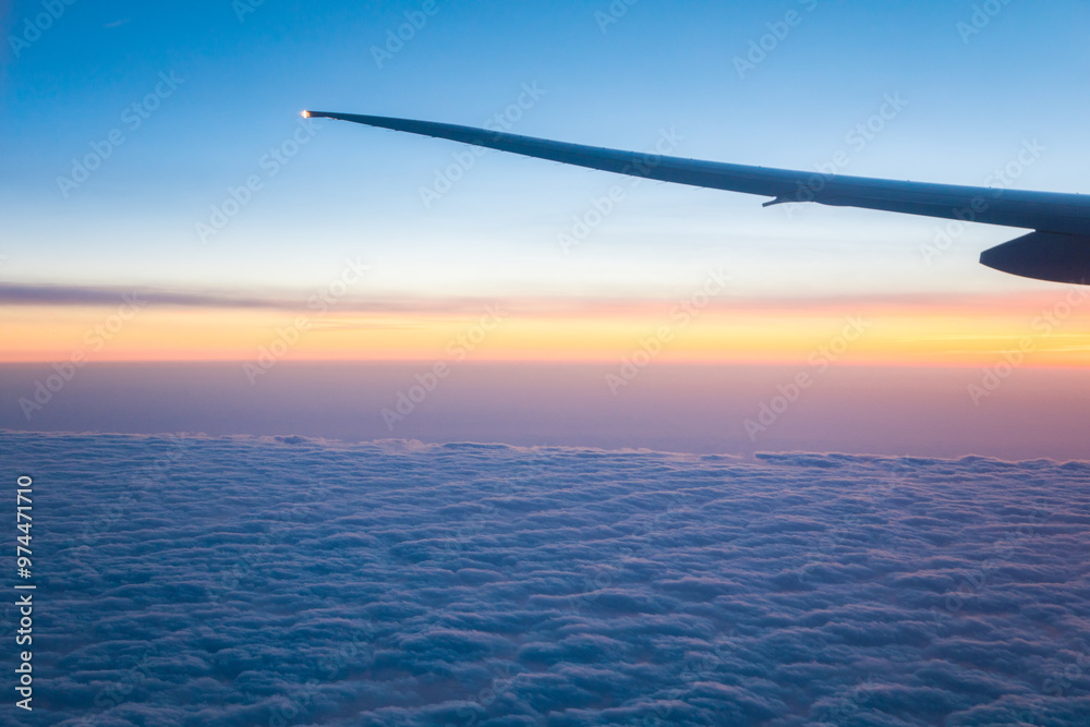 China Shanghai - Sunrise above the clouds from the plane China Shanghai - Sunrise above the clouds from the plane