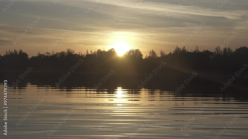 Warm summer sunrise-sunset over the northern river, calm water (breathless), but colors of an alarming sunset