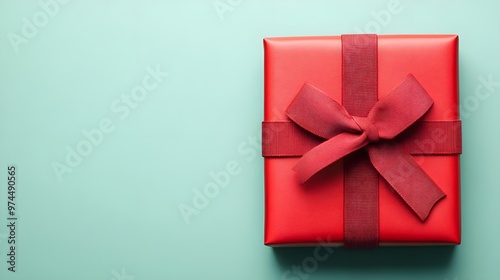 Red Gift Box with Bow on Mint Background