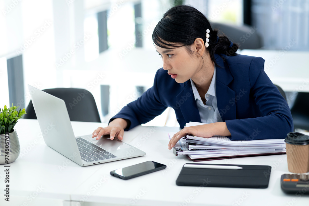 Young businesswoman with her hands on her head looking seriously Young businesswoman with her hands on her head looking seriously