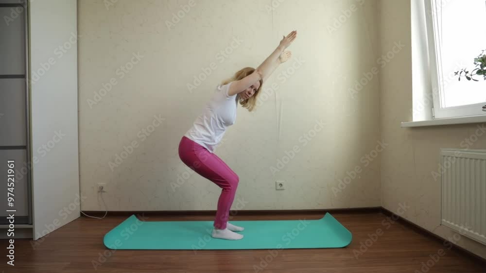 Woman doing yoga at home,maintaining a peaceful zen lifestyle, enjoying a tranquil moment of stretching and relaxation Woman doing yoga at home,maintaining a peaceful zen lifestyle, enjoying a tranquil moment of stretching and relaxation