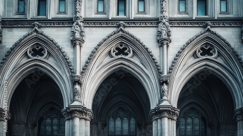The facade of a historic government structure with gothic architectural features, including pointed arches,