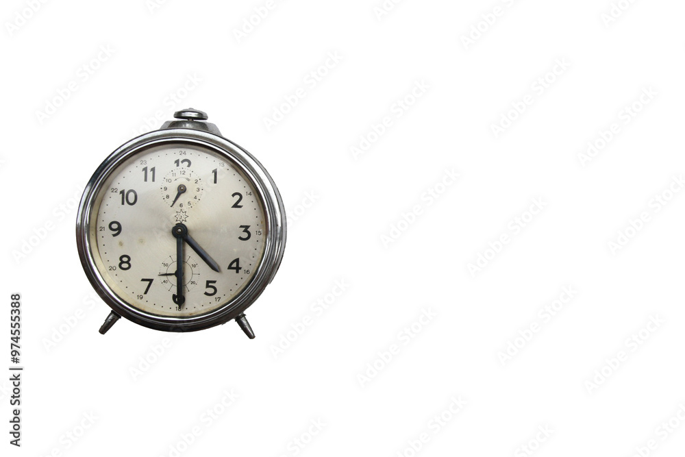 Old alarm clock isolated on a white background with copy space, half past four Old alarm clock isolated on a white background with copy space, half past four
