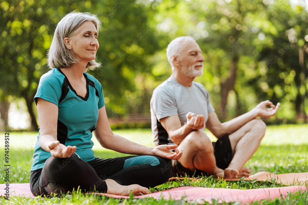 Senior couple practicing yoga outdoors for mindfulness and wellbeing, health care concept Senior couple practicing yoga outdoors for mindfulness and wellbeing, health care concept