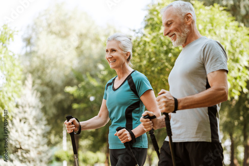 Senior couple engaging in nordic walking for fitness and well-being