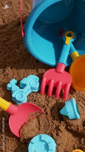 Wallpaper Mural Sand children's set with a watering can, bucket and shovels with molds on the sunny sea sand Torontodigital.ca