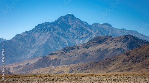 A mountain range with a clear sky in the background.