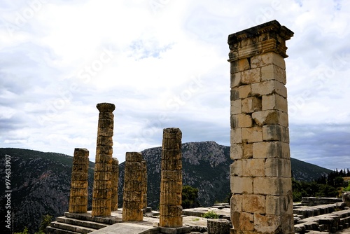 Ruins of the ancient Temple of Apollo in Delphi with its mighty round columns in Greece, overlooking the valley of Phocis on a sunny day in summer