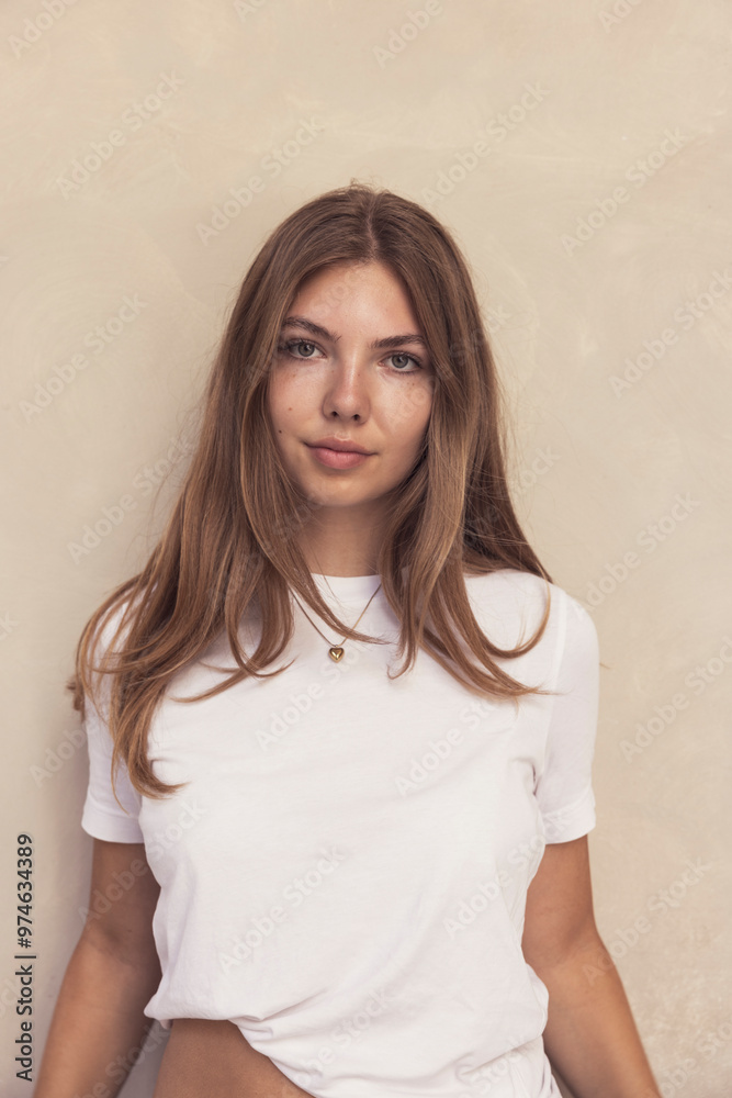 Portrait of young pretty girl looking into the camera in a happy mood. Portrait of young pretty girl looking into the camera in a happy mood.