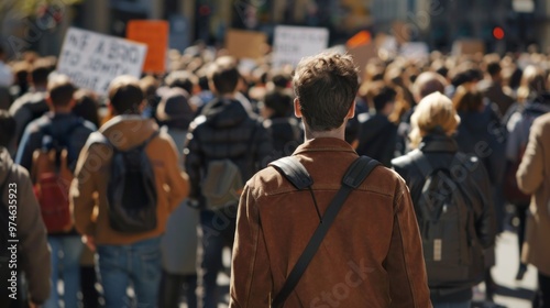 A man stands in a crowd of protesters holding a sign that says "No to a bad deal