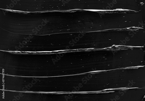 Texture of black acrylic paint. Image is ideal for creative projects, background designs or illustrations where cleanliness and sophistication are required.