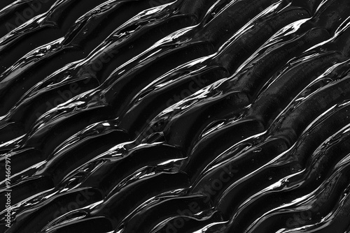 Texture of black acrylic paint. Image is ideal for creative projects, background designs or illustrations where cleanliness and sophistication are required.