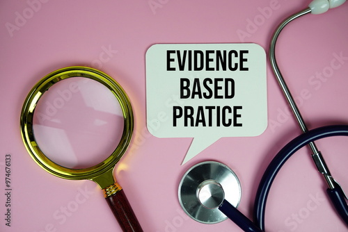 Evidence based pratice text with stethoscope and magnifying glass on pink background, Healthy and wellness concept photo