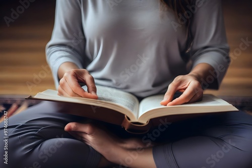 A woman seated in a meditative pose, holding a book, representing the fusion of mindfulness, learning, and inner peace. - Meditation, Mind Relaxation