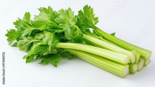 Fresh green celery stalks arranged neatly on a white background.