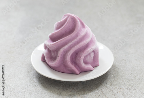 Black Grape ice cream, sorbet in the form of French Chantilly cream. On a plate. Light grey background