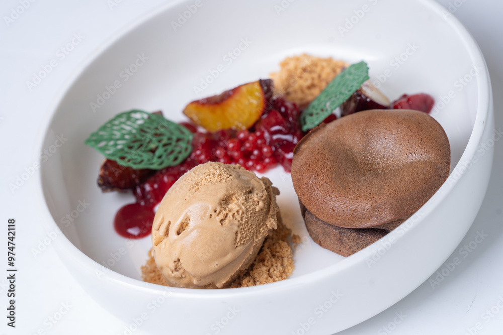 chocolate fondant with ice cream salted caramel with plum and crumble white background chocolate fondant with ice cream salted caramel with plum and crumble white background