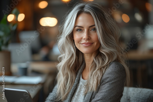 Wallpaper Mural Smiling woman with long blonde hair in a cafe Torontodigital.ca