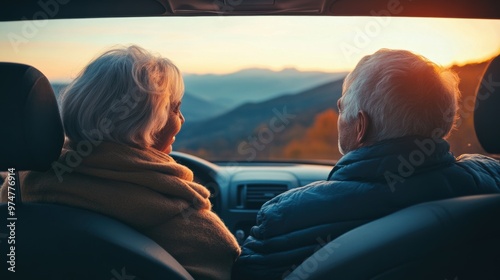 Senior couple enjoying a scenic sunset drive through the mountains