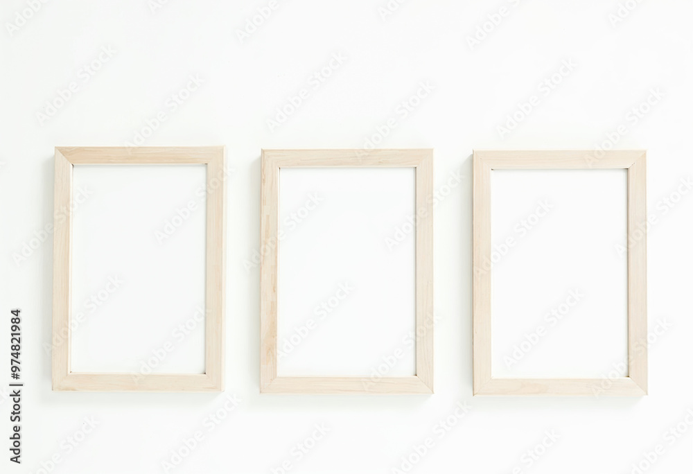 Three Wooden Picture Frames Mockup Minimalist Interior Design Elements Blank Wall Space Artwork Display Home Decor Inspiration Neutral Color Palette Scandinavian Style Three Wooden Picture Frames Mockup Minimalist Interior Design Elements Blank Wall Space Artwork Display Home Decor Inspiration Neutral Color Palette Scandinavian Style