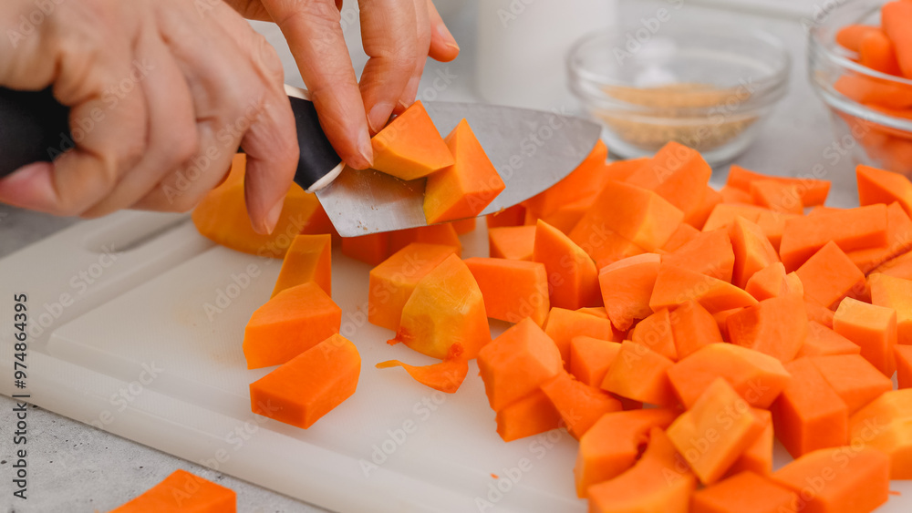 Butternut squash soup recipe. Raw vegetables close-up on the kitchen table. Peeled and seedless butternut squash close-up on a cutting board Butternut squash soup recipe. Raw vegetables close-up on the kitchen table. Peeled and seedless butternut squash close-up on a cutting board