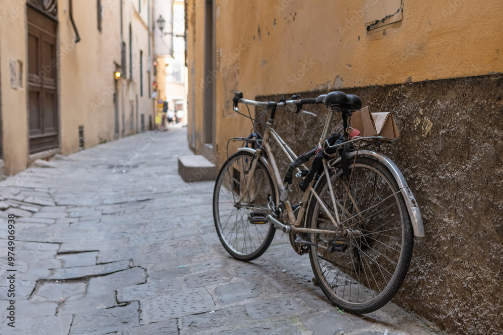 Bicycle parked on a medieval street in Florence, Tuscany. Bicycle parked on a medieval street in Florence, Tuscany.