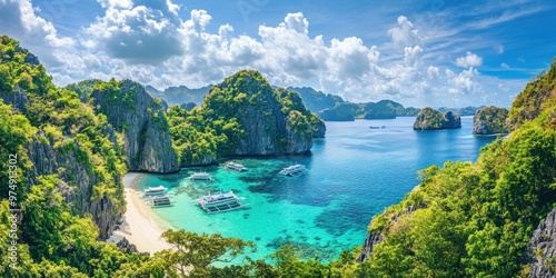 A panoramic view of a tropical lagoon with turquoise water, white sand beaches, and lush green vegetation.