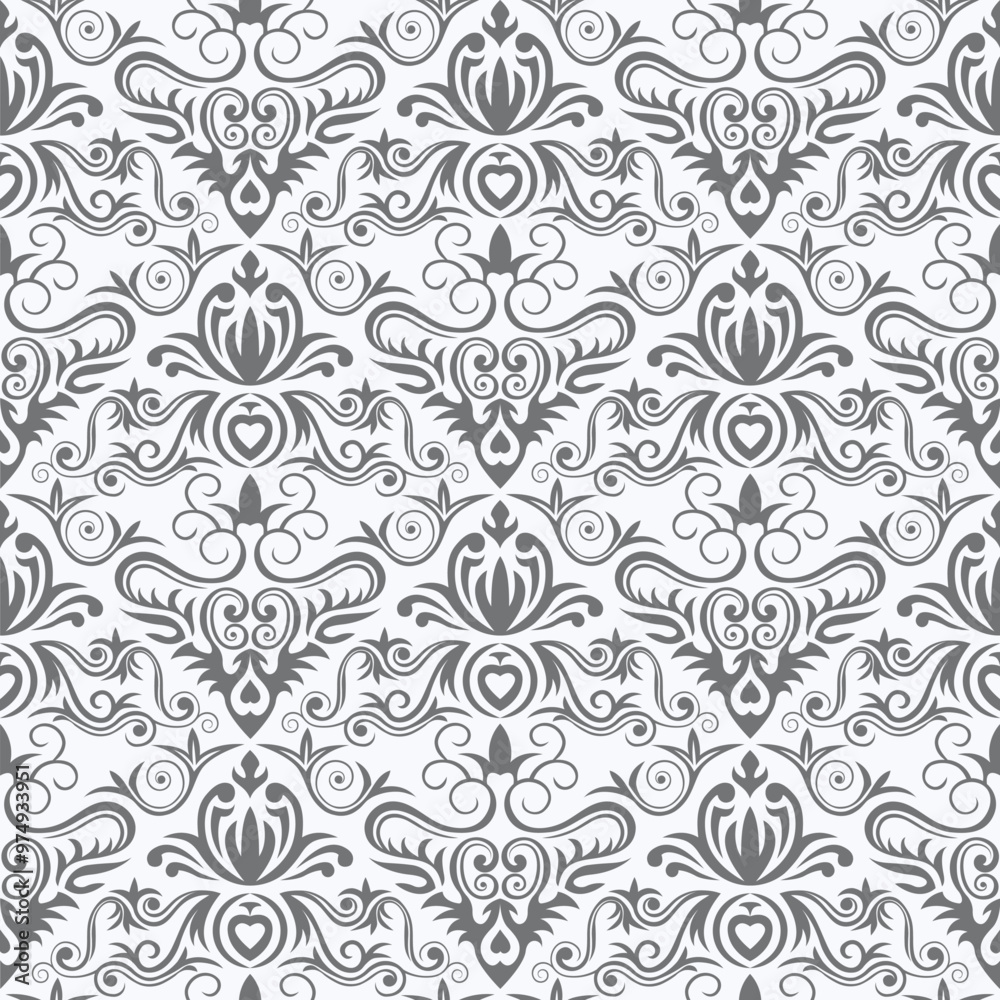 A decorative pattern featuring intricate floral and swirl designs in gray tones on a light background. A decorative pattern featuring intricate floral and swirl designs in gray tones on a light background.