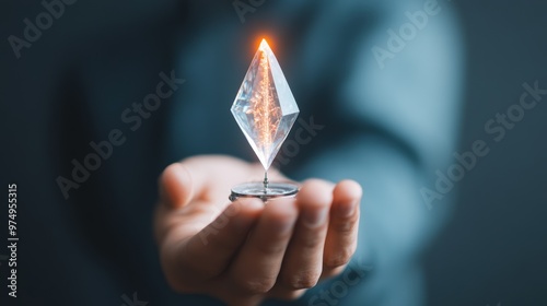 A businessman holding a compass with a spinning, multi faceted crystal at its center, representing the many possibilities and directions a decision can lead to. photo