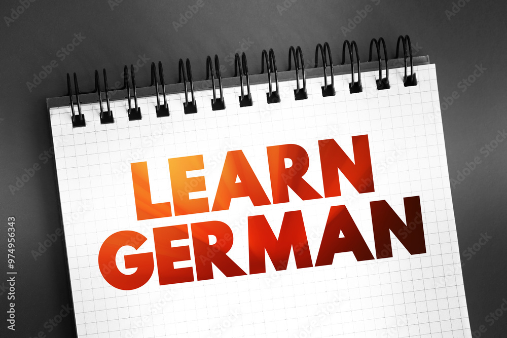 Fototapeta premium Learn German text quote on notepad, concept background