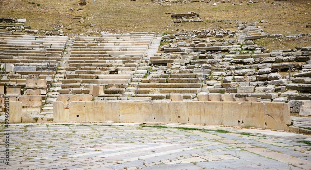 Remains of marble benches from the ancient greek amphitheater of the ...