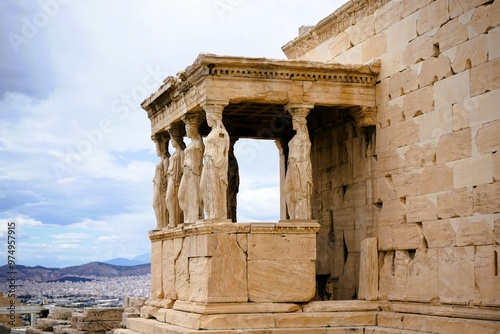 Athens, Greece, 08.26.2024: Famous marble statutes on The Porch of the Caryatids in the  Erechtheum on the hill of the Acropolis of Athens in Greece, Sightseeing and vacation in Griechenland